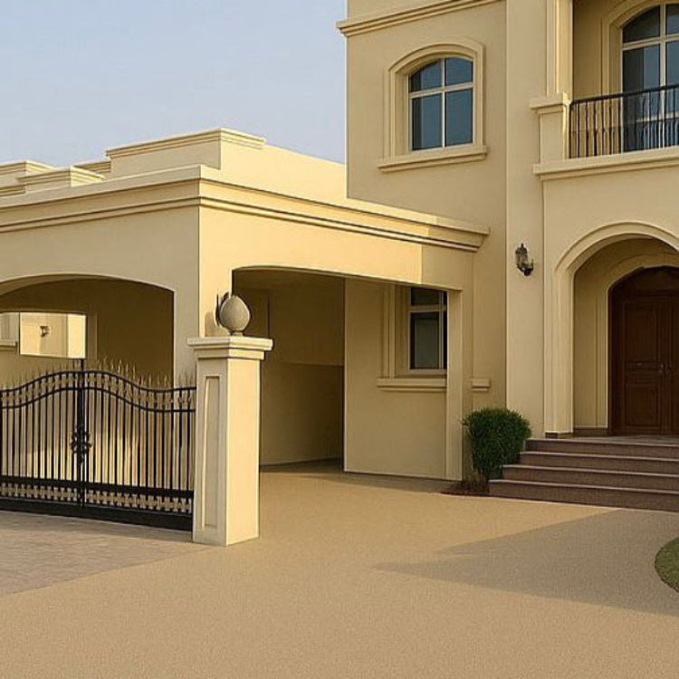 Beige house with a black metal gate and decorative elements